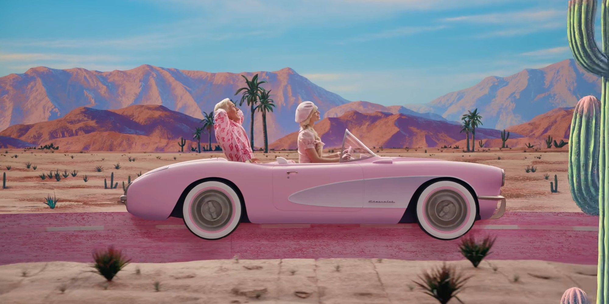 Margot Robbie and Ryan Gosling in a pink car in a desert in Barbie