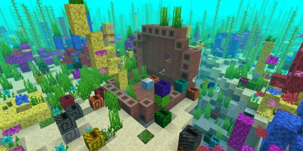 A colorful reef in Minecraft on the ocean floor, with a large open clam in the middle of the screen