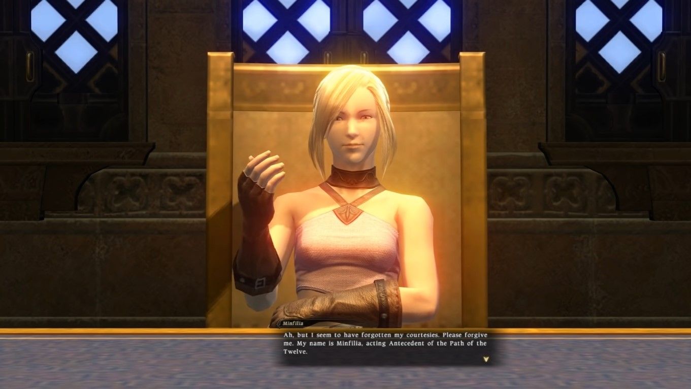 Minfilia in Final Fantasy 14 1.0 version sat at a desk.