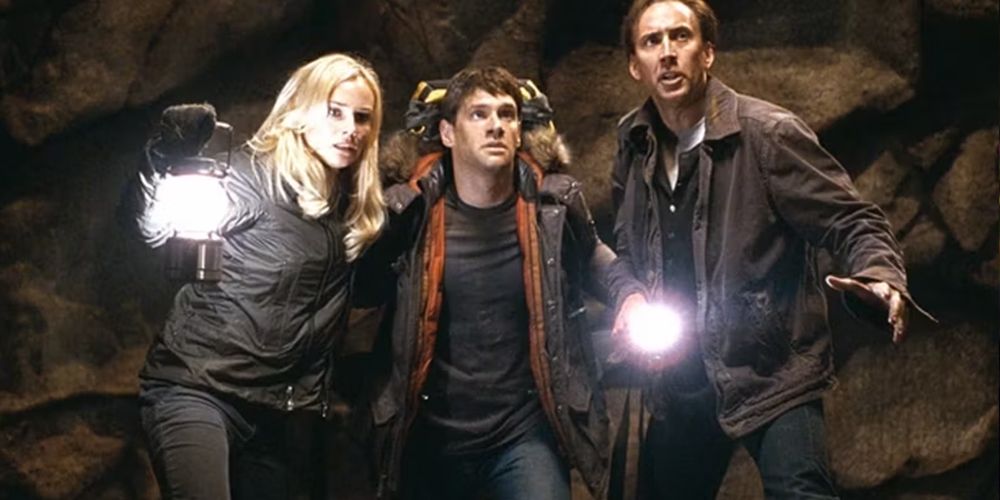 Riley Poole holding flashlight with Ben Gates National Treasure 