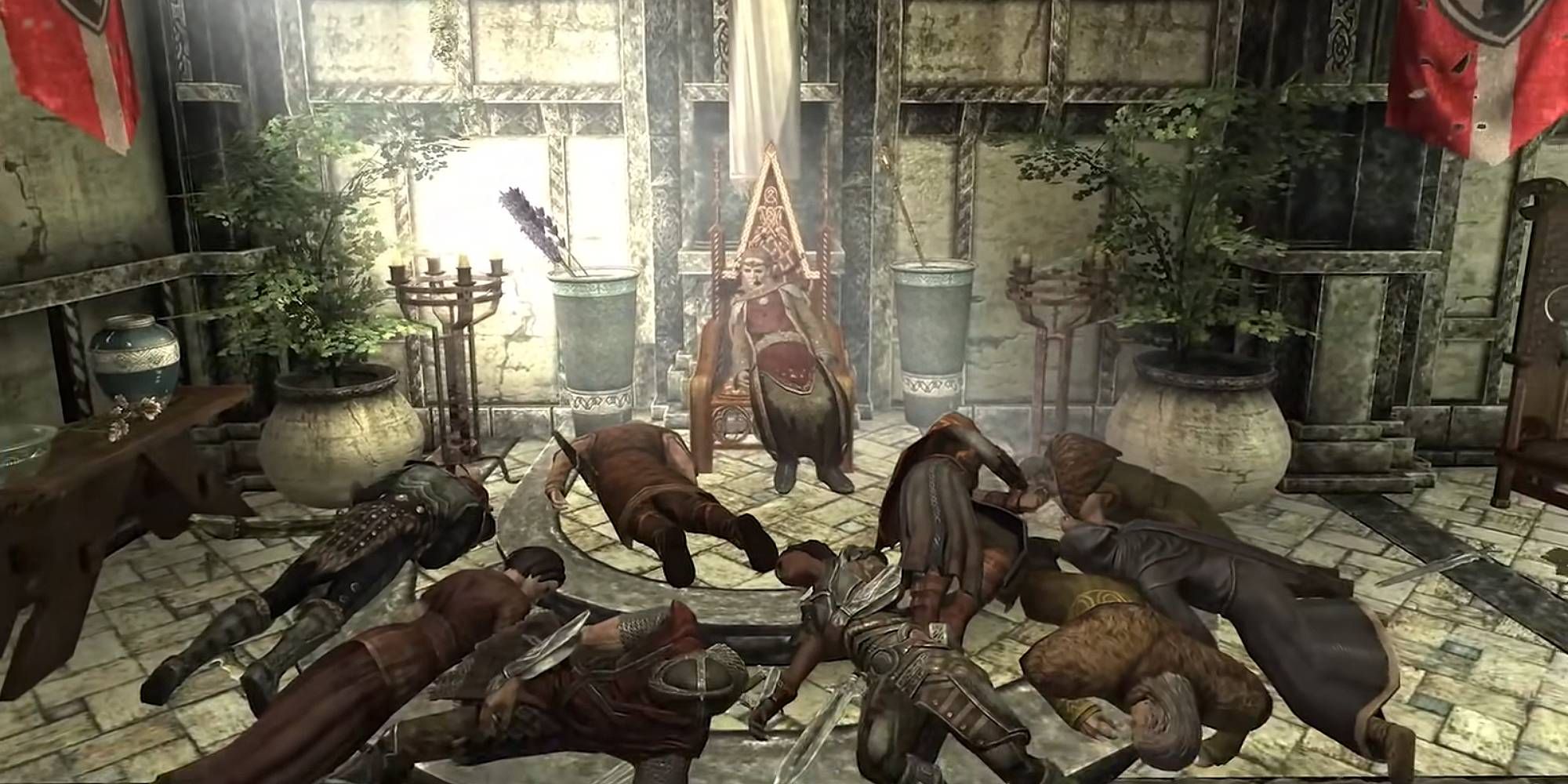 A deceased woman on a throne surrounded by corpses