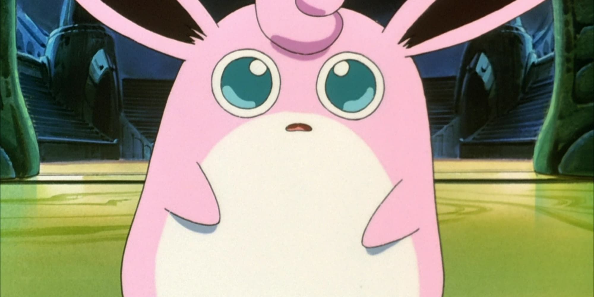 Wigglytuff stands and looks confused in the center of a battle arena in Pokemon.