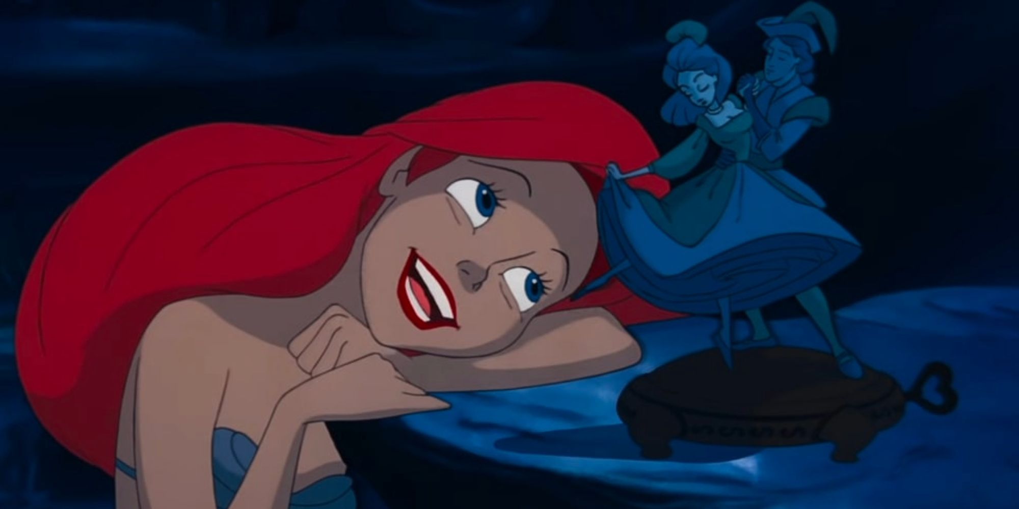 Ariel singing as she watches dancers on a music box in her grotto
