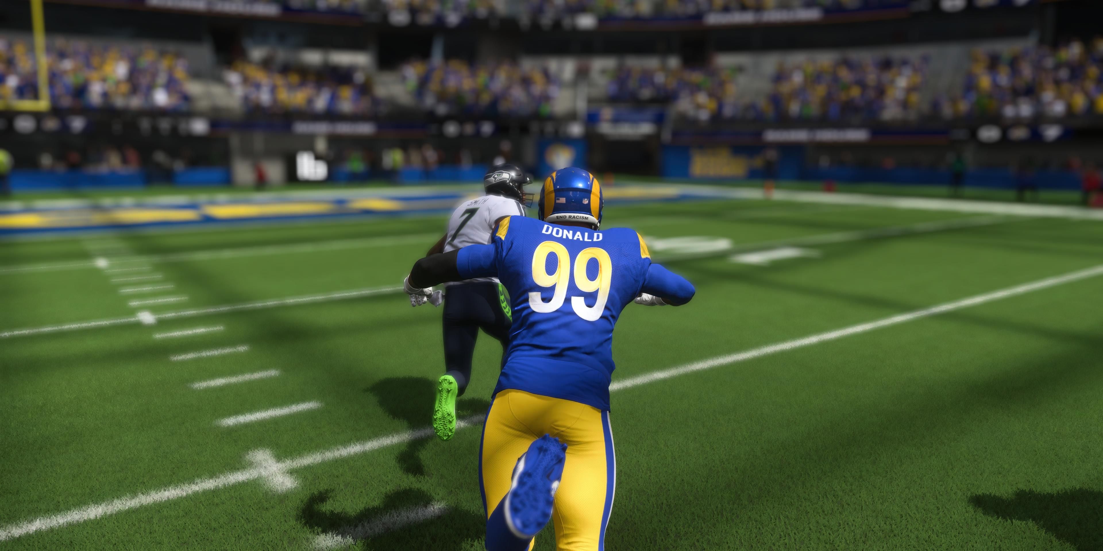 Aaron Donald diving toward the quarterback