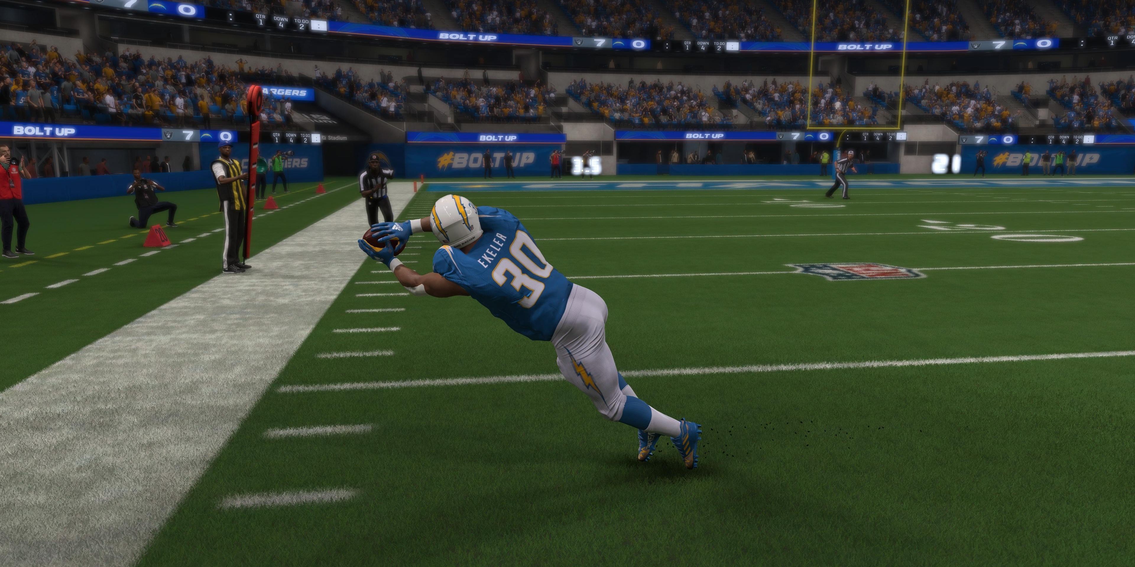 Austin Ekeler diving for a catch