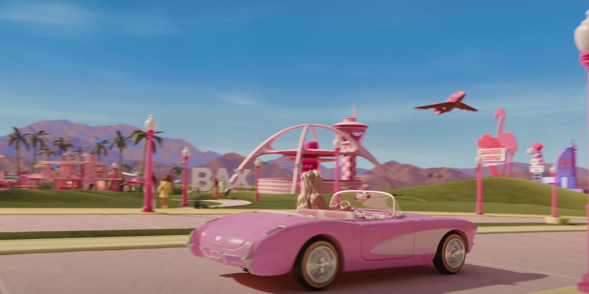 Barbie in a car passing an airport