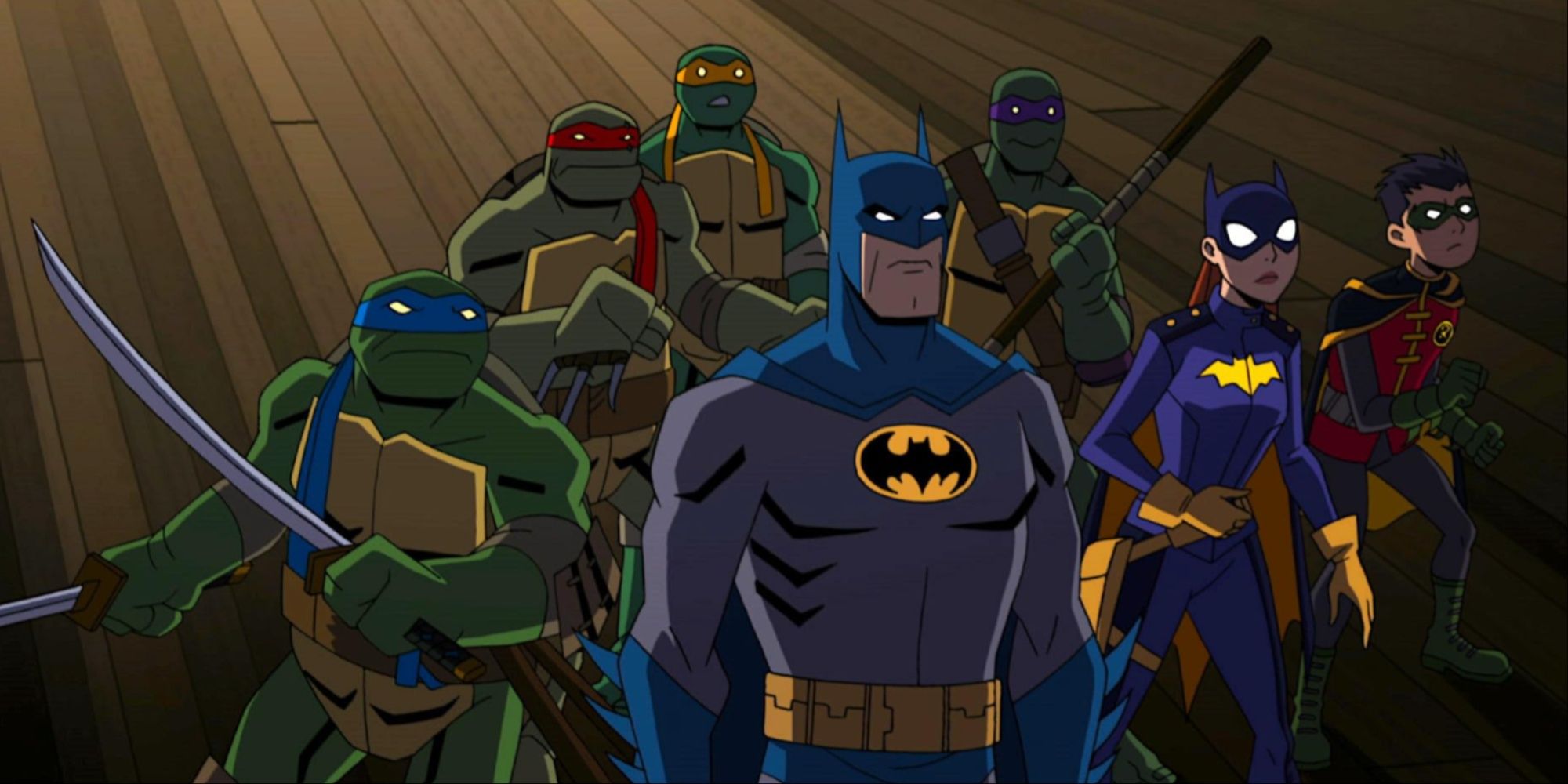 The Teenage Mutant Ninja Turtles with weapons out behind Batman, Batgirl, and Robin in the animated movie.