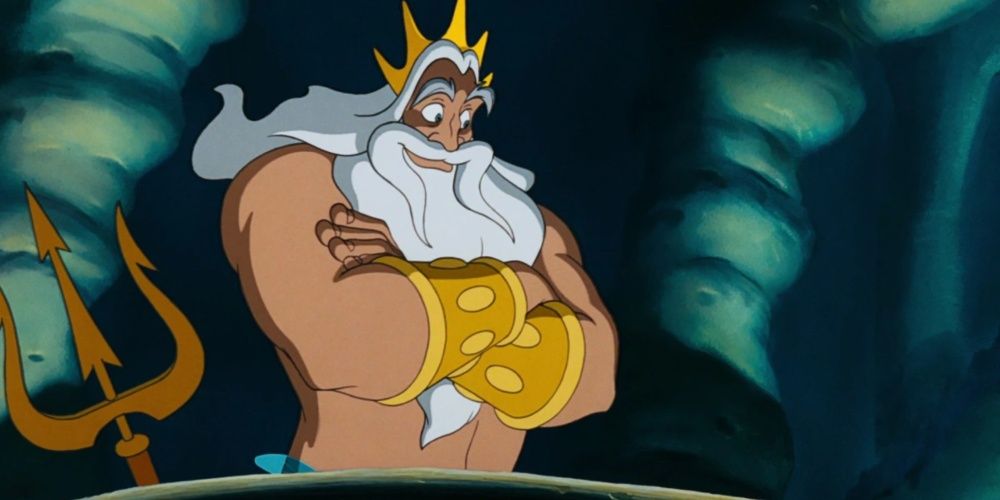 King Triton smiling down with his arms crossed in Disney's Little Mermaid.