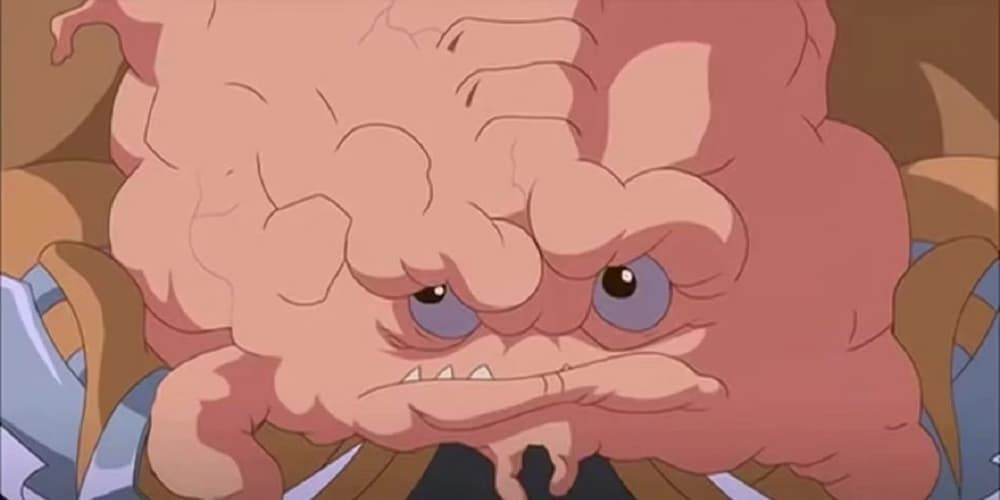 Krang sits in the hands of his host body.