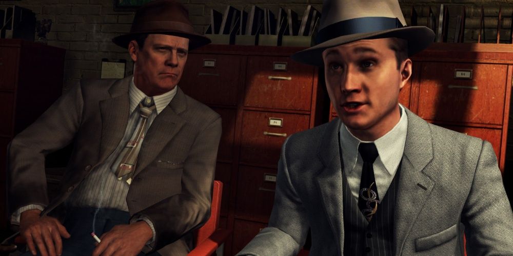 LA Noire Cole Phelps and Ralph Dunn sitting together in an office