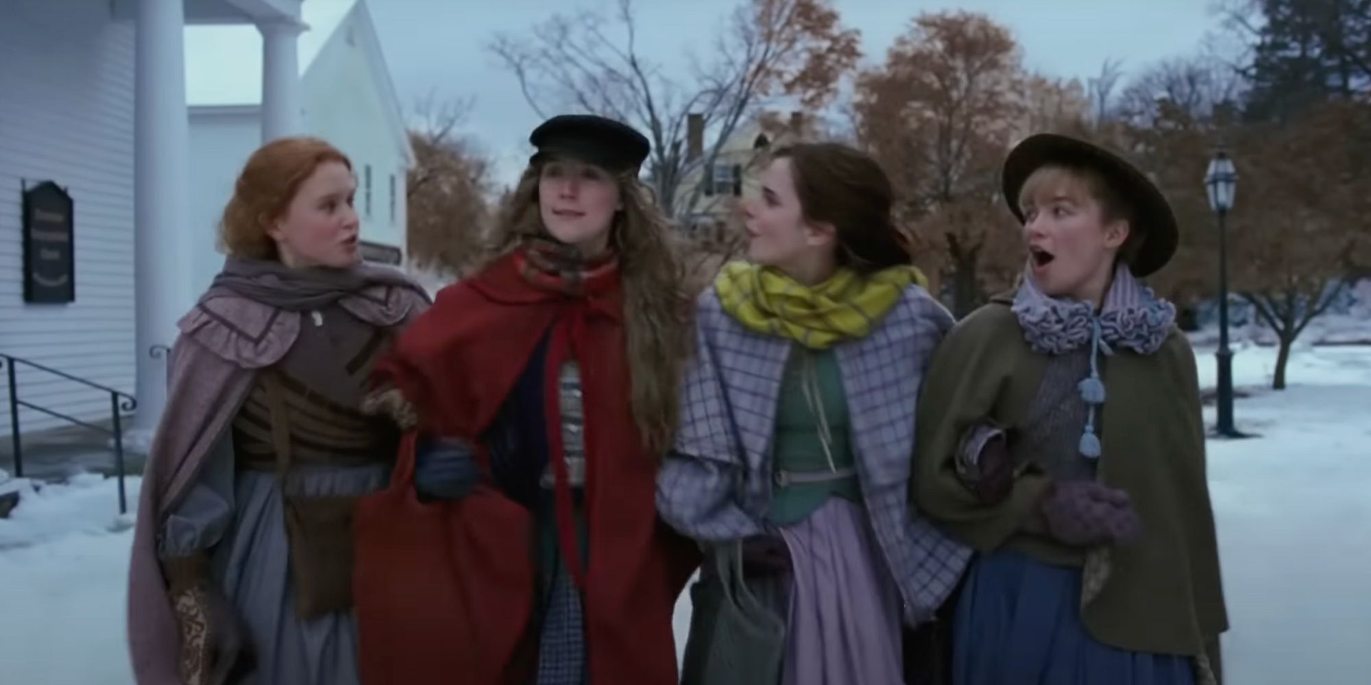 The four March sisters walk through the snow in Little Women