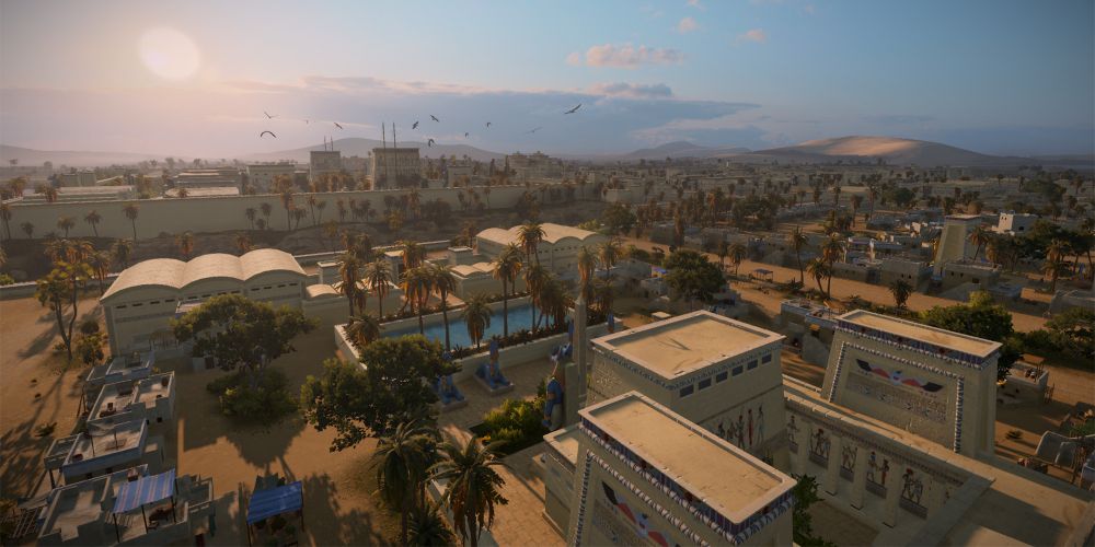The sun sets over the Egyptian city of Pi-Ramesses in Total War: Pharaoh