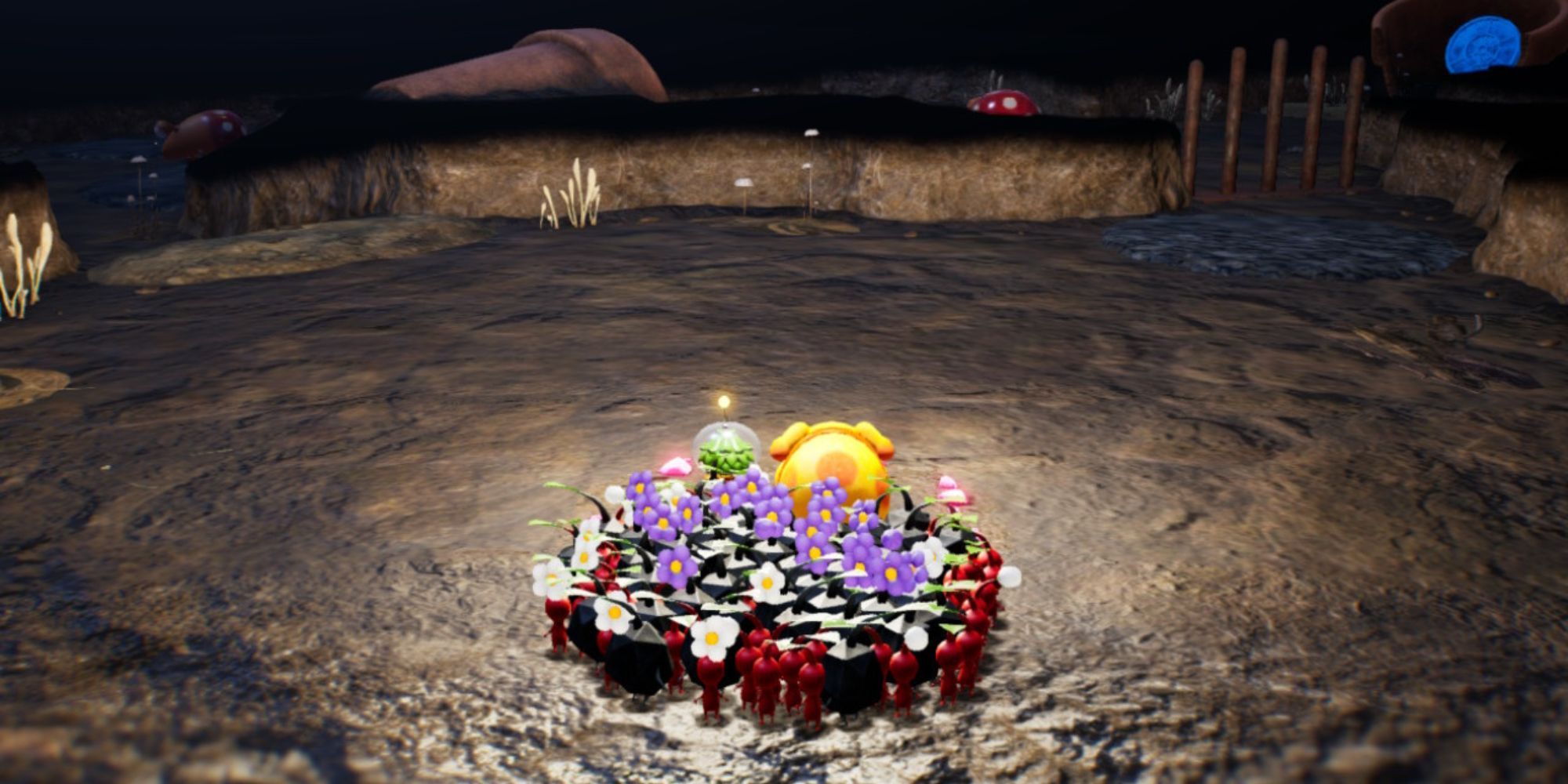 The main character, Oatchi, and a group of Pikmin sit at the entrance of a cave