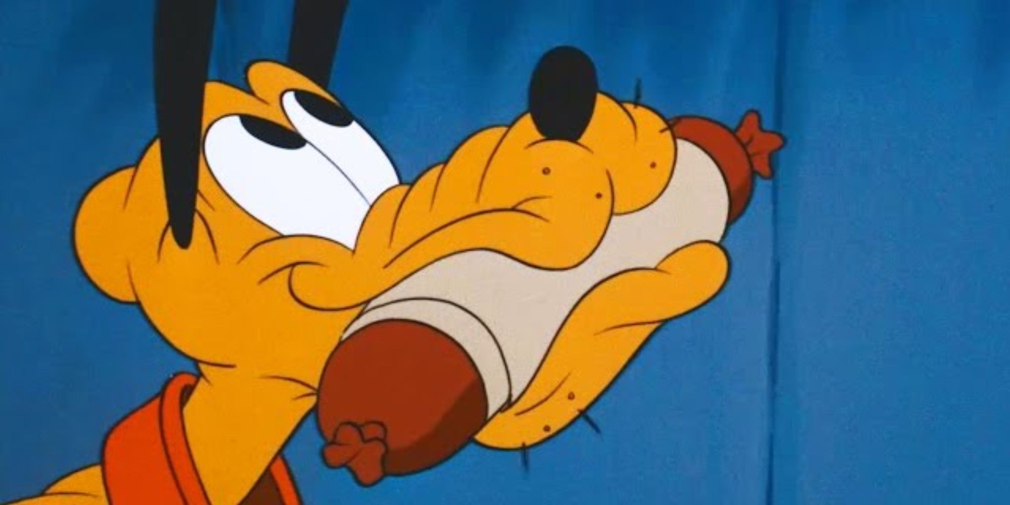 Pluto holding a sausage in his mouth in a Mickey cartoon