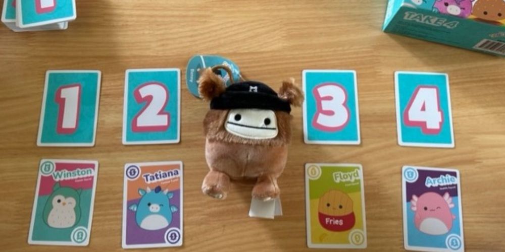 Squishmallows Take4 card game set up on a table