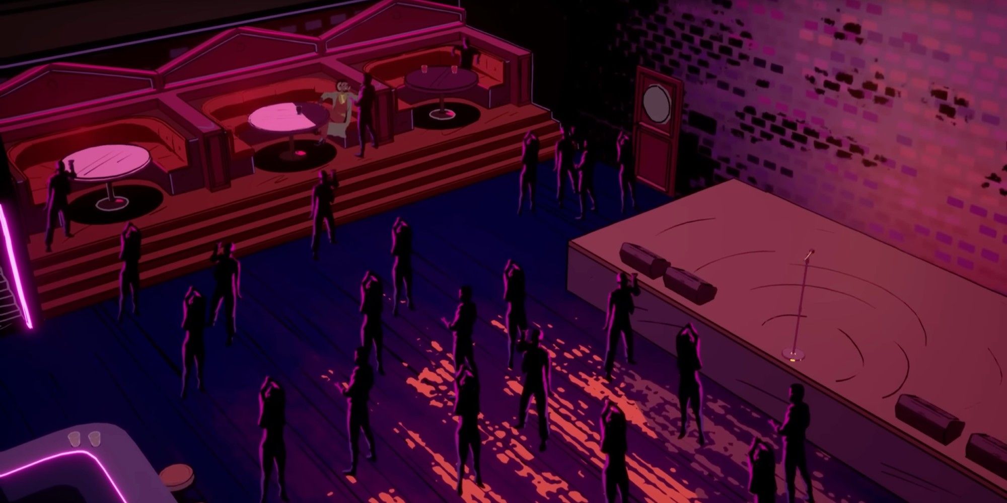 several people are standing on the dance floor in front of the main stage