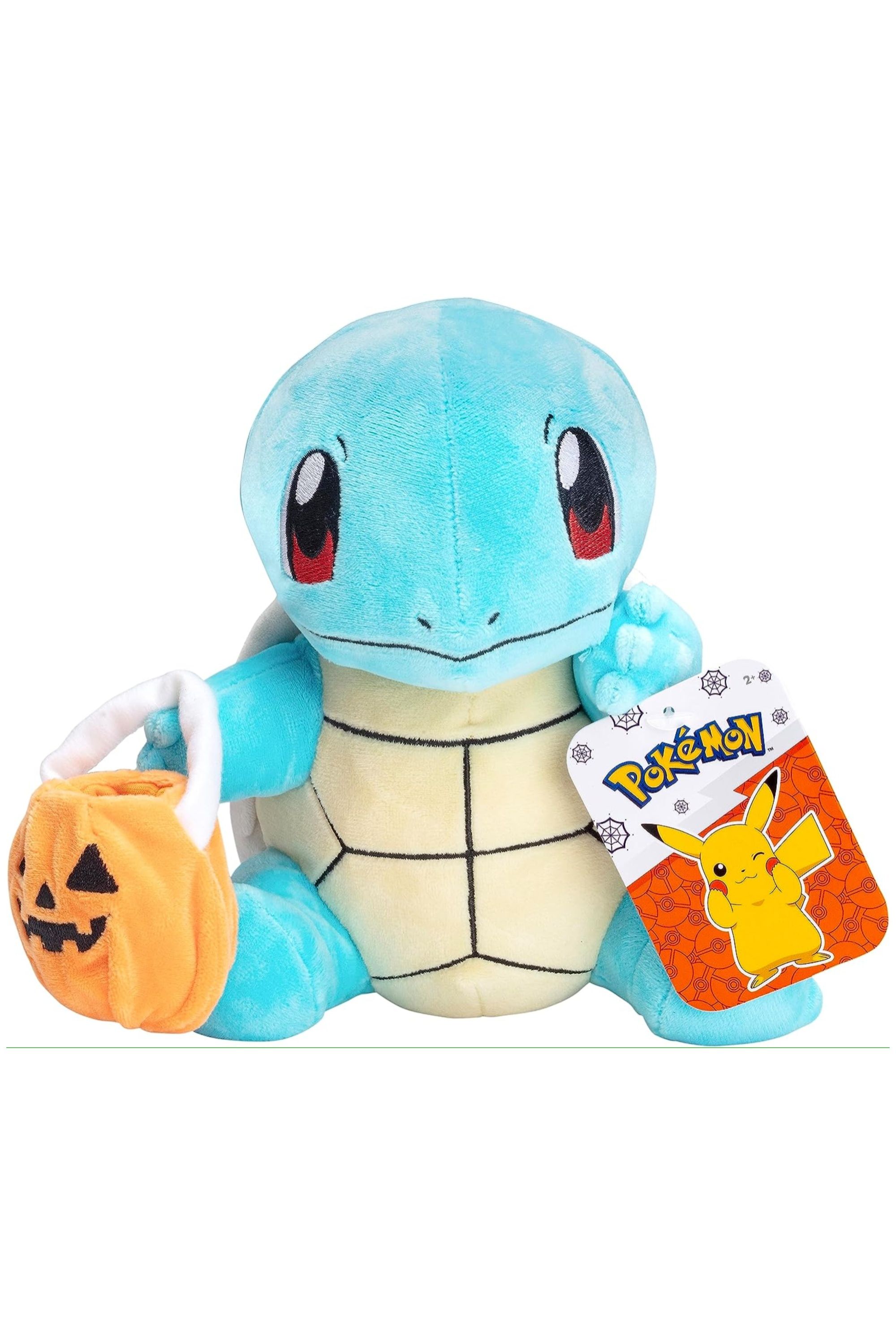 squirtle plush holding a pumpkin bag