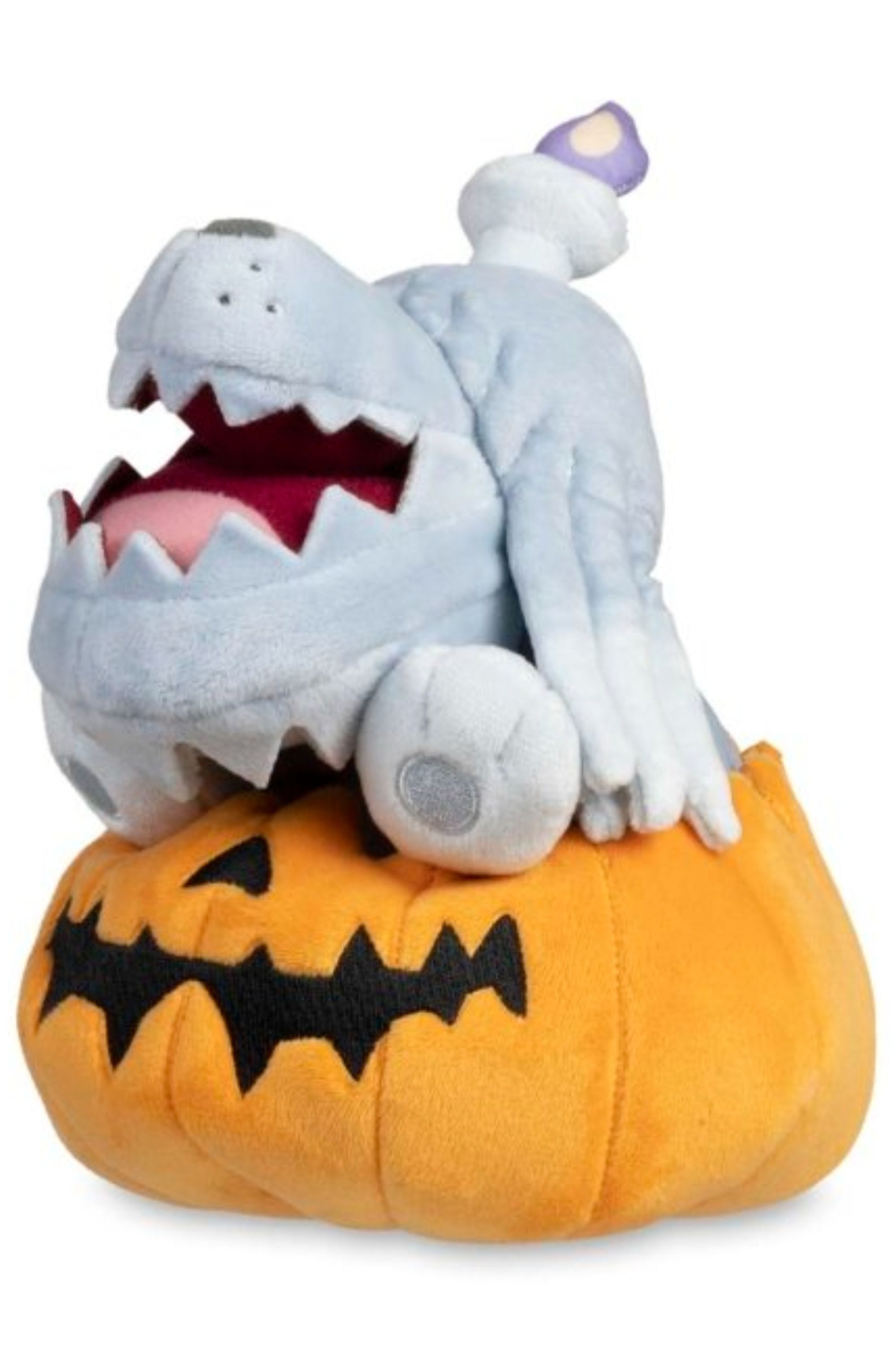 greavard sitting in a pumpkin pokemon plush