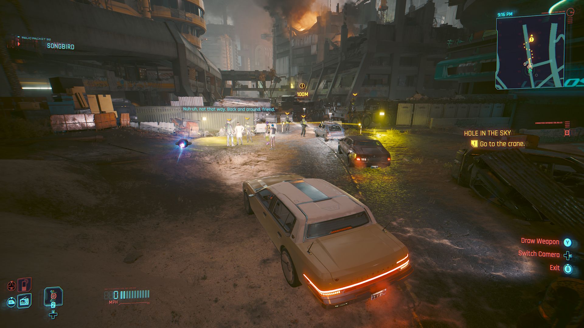 Cyberpunk 2077 Phantom Liberty Screenshot Of Player In Car Near Roadblock