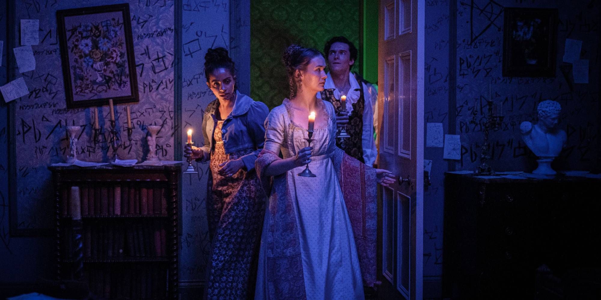 Yaz, Lord Byron and Mary Woolstonecraft Godwin in a room holding candles 