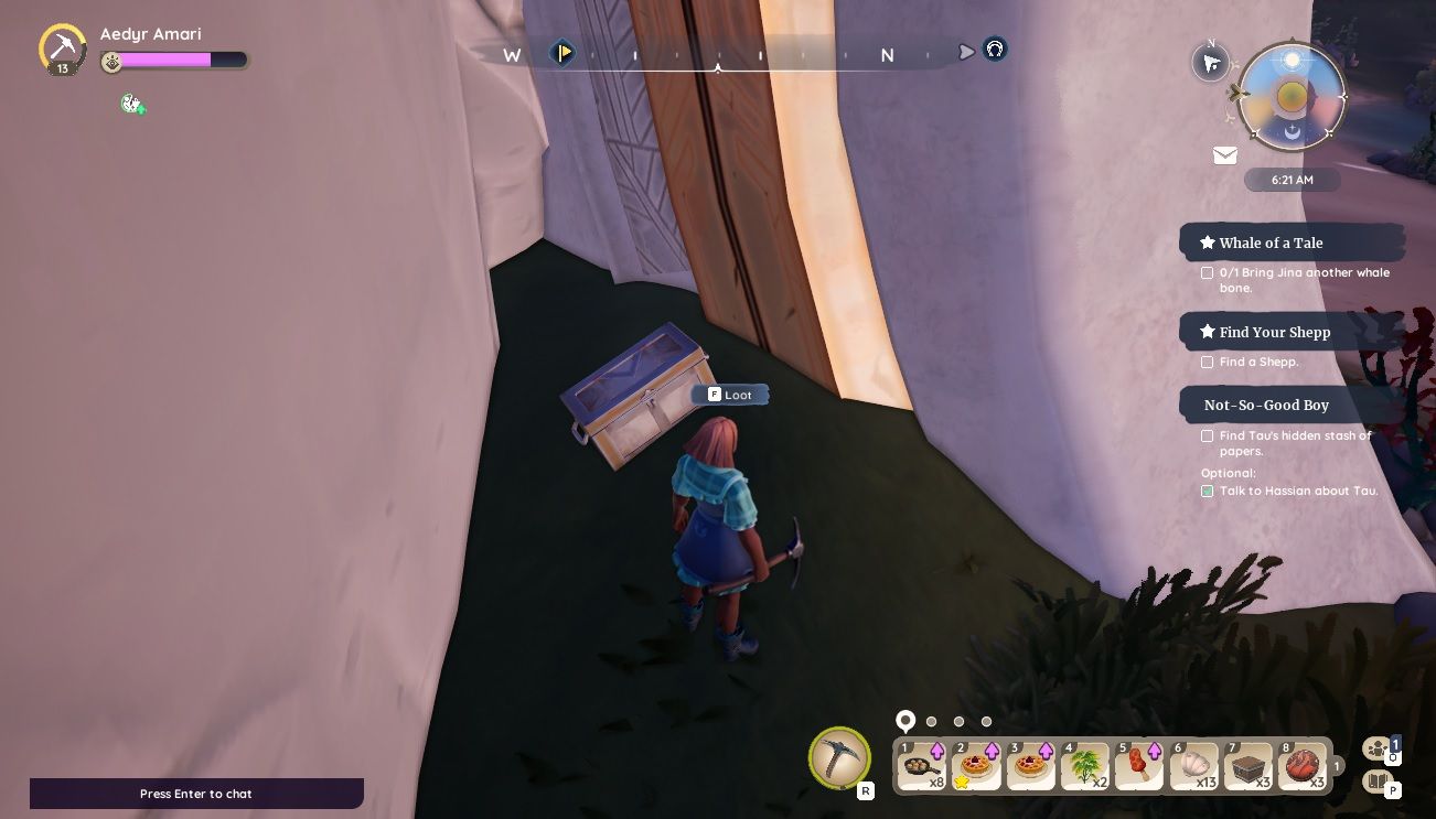 Player character standing next to a chest hidden next to a large ruin directly behind the Beachcomber Cover fast travel point in Palia.
