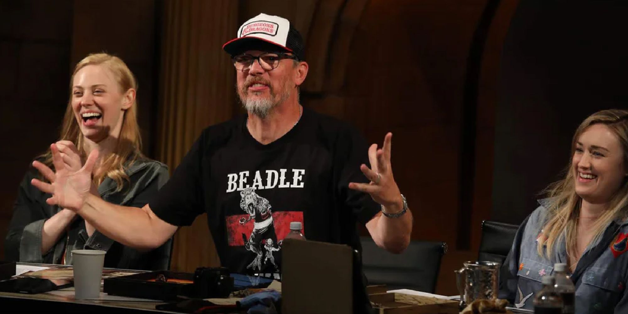 Matthew Lillard with a Beadle & Grimm's shirt, spreading his arms out 