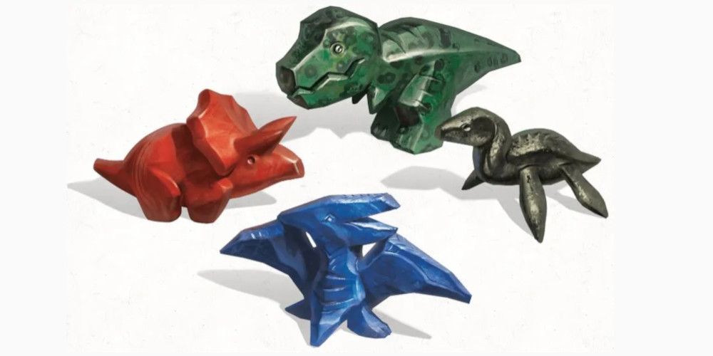 An assortment of four different colorful figurines, all resembling different dinosaurs.