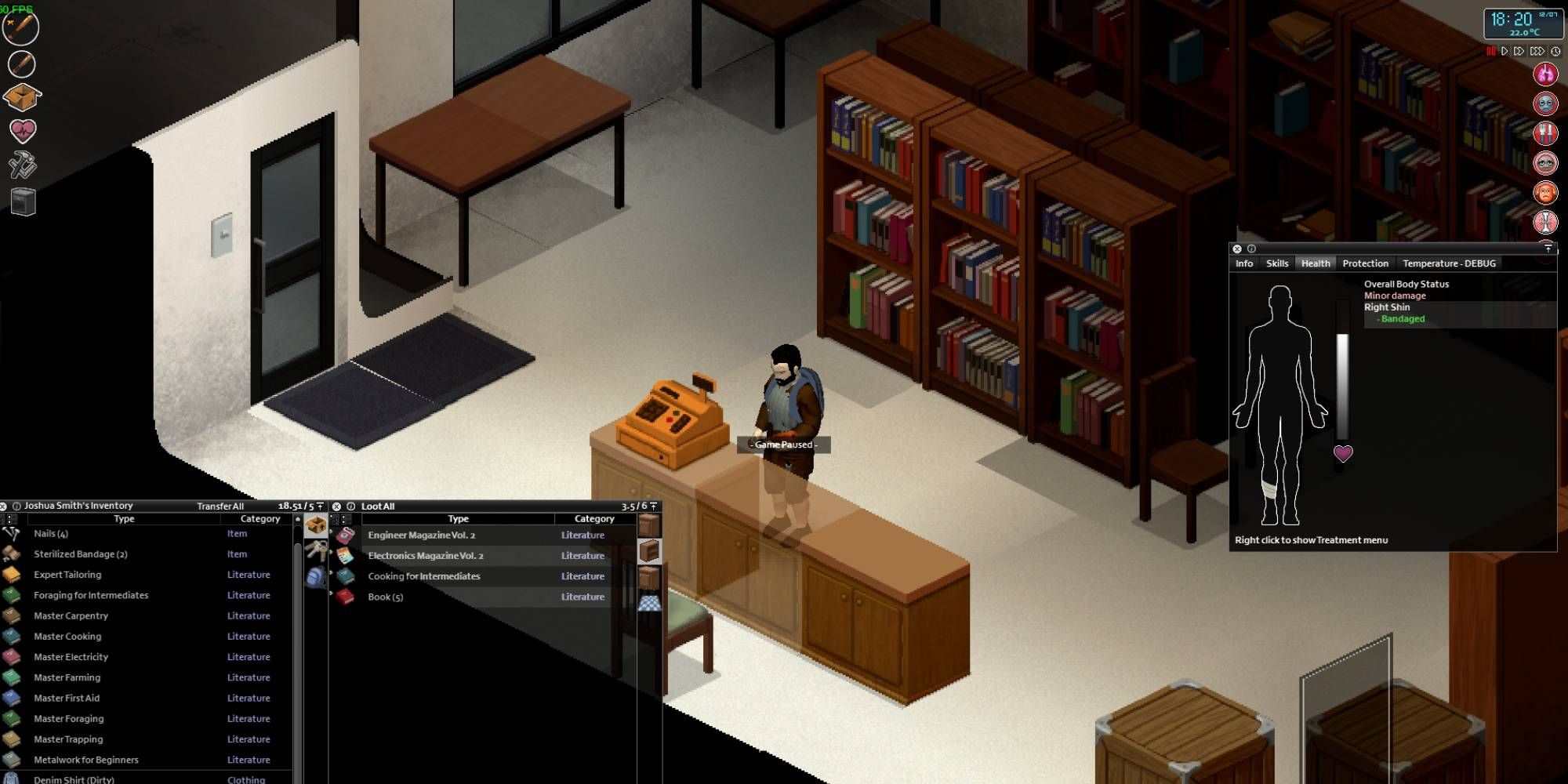 A man standing by a cash register in a bookstore