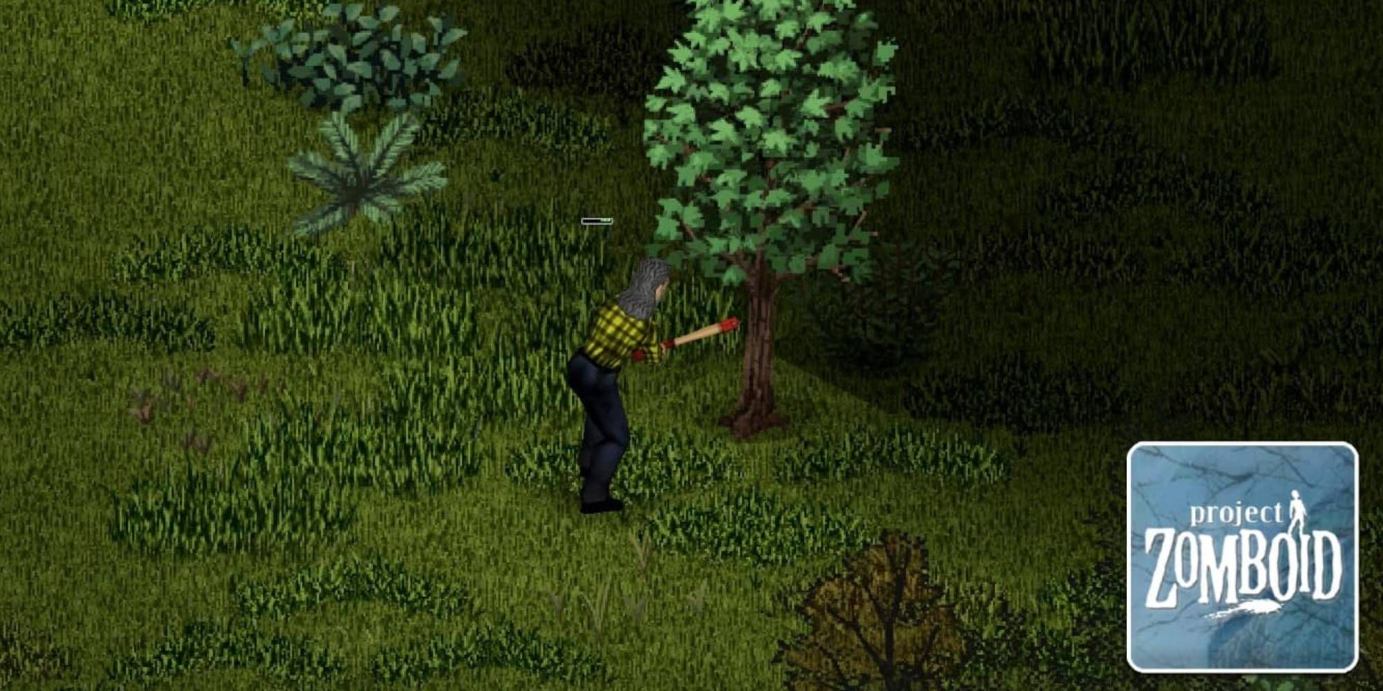 A man holding an axe and chopping down a tree