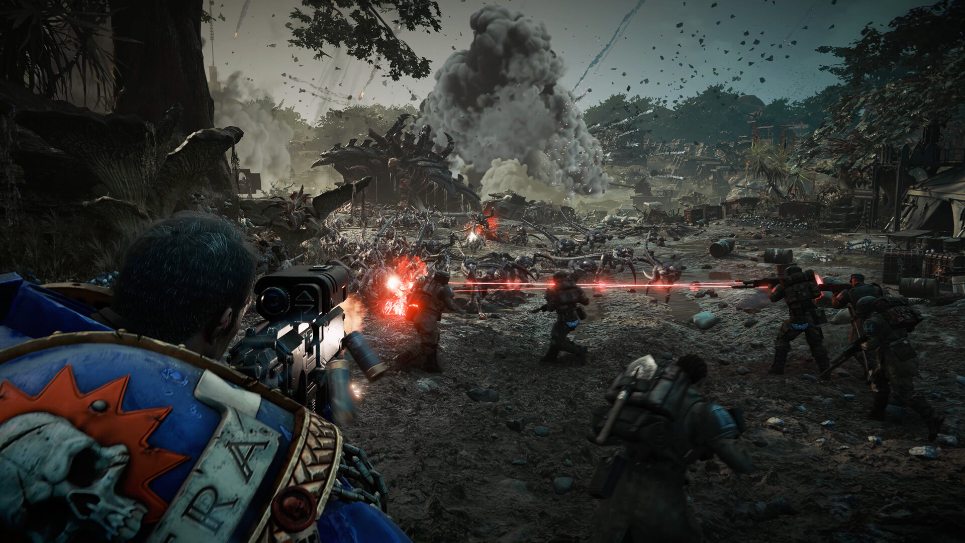 Titus shooting Tyranids in Space Marine 2.