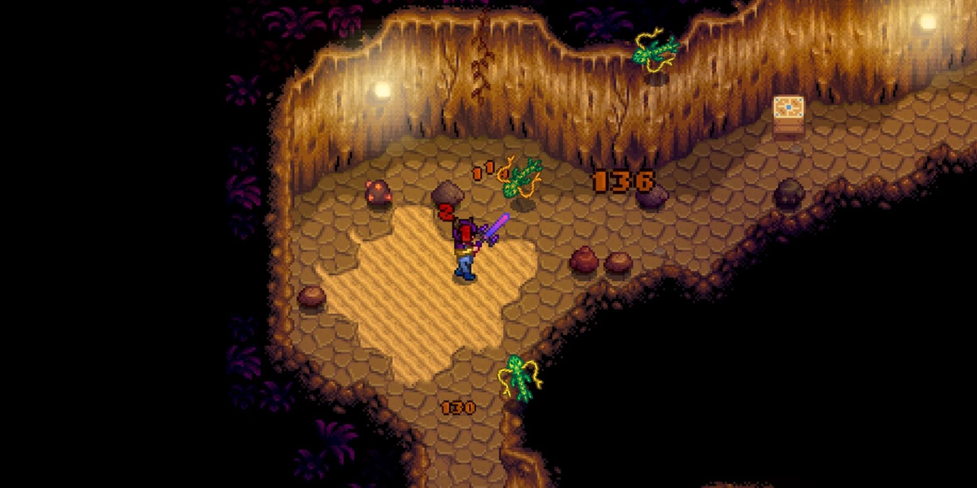 Stardew Valley player fighting three enemies in the mines
