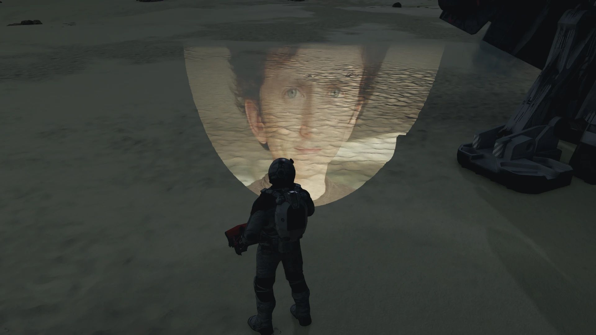 Todd Howard's face projected onto a planet's surface, right in front of the player character
