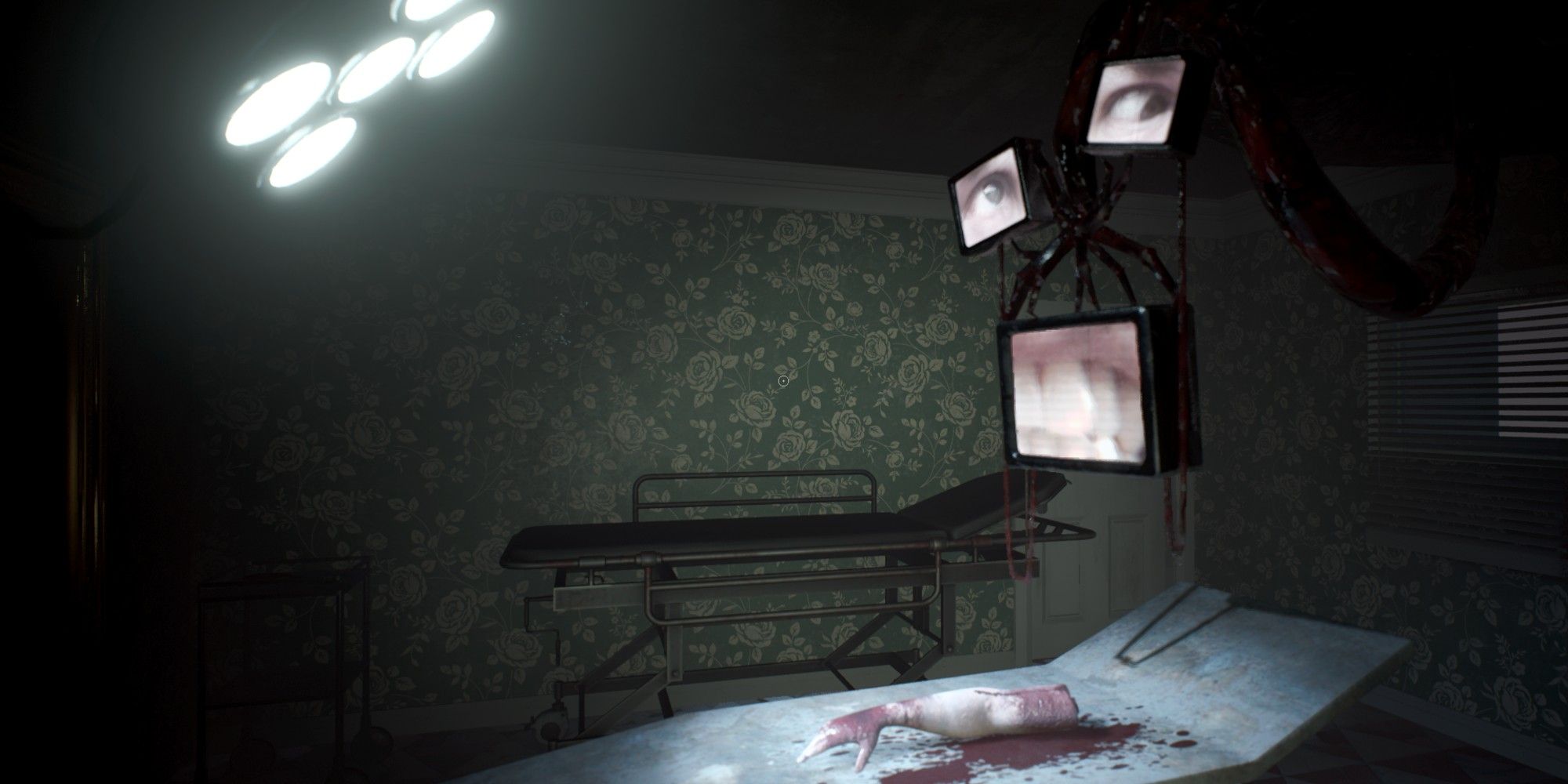 A bloodied medical bed with a bright light shining on the bed in inflicion