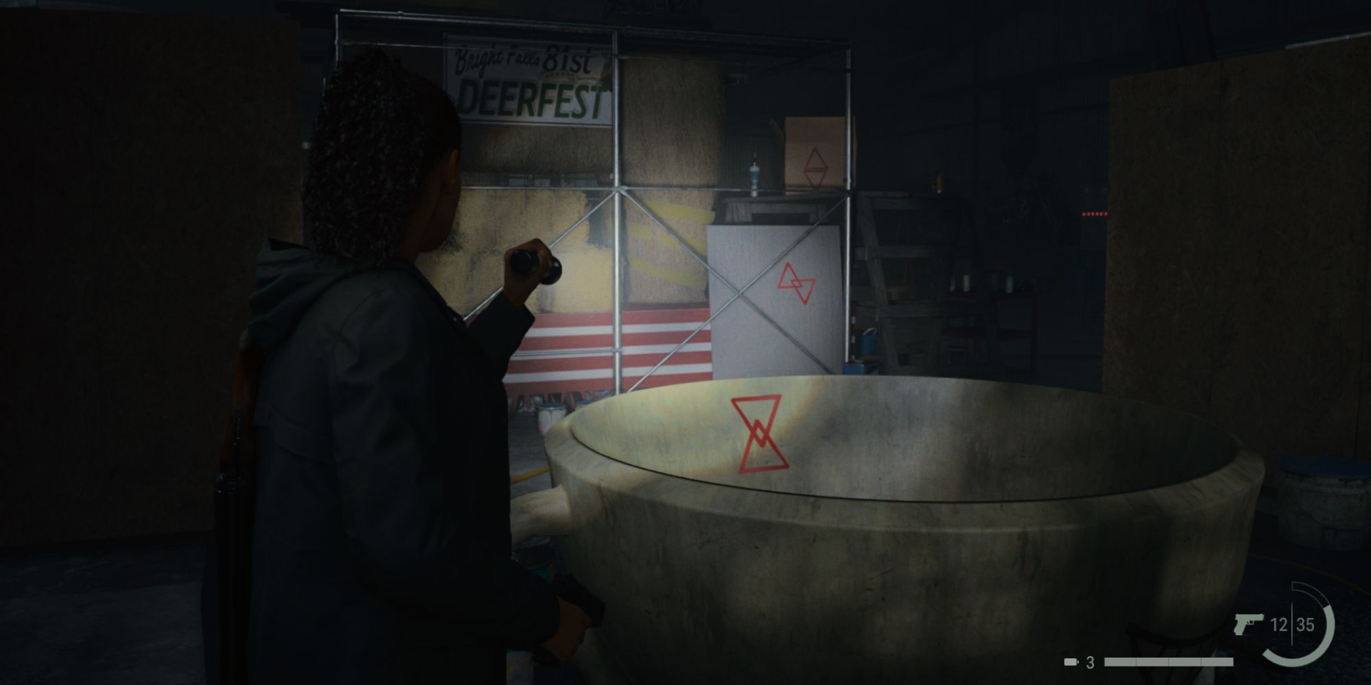 Saga Anderson uses her flashlight to illuminate three sets of Cult of the Tree markings in the Kalevala Knights Motorcycle Workshop in Alan Wake 2