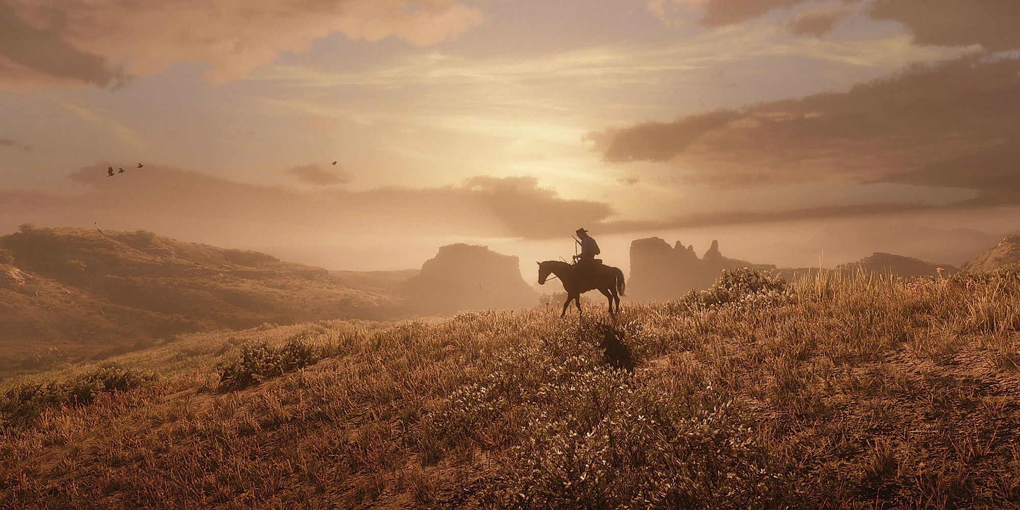 Arthur riding his horse into the sunset in Red Dead Redemption 2.