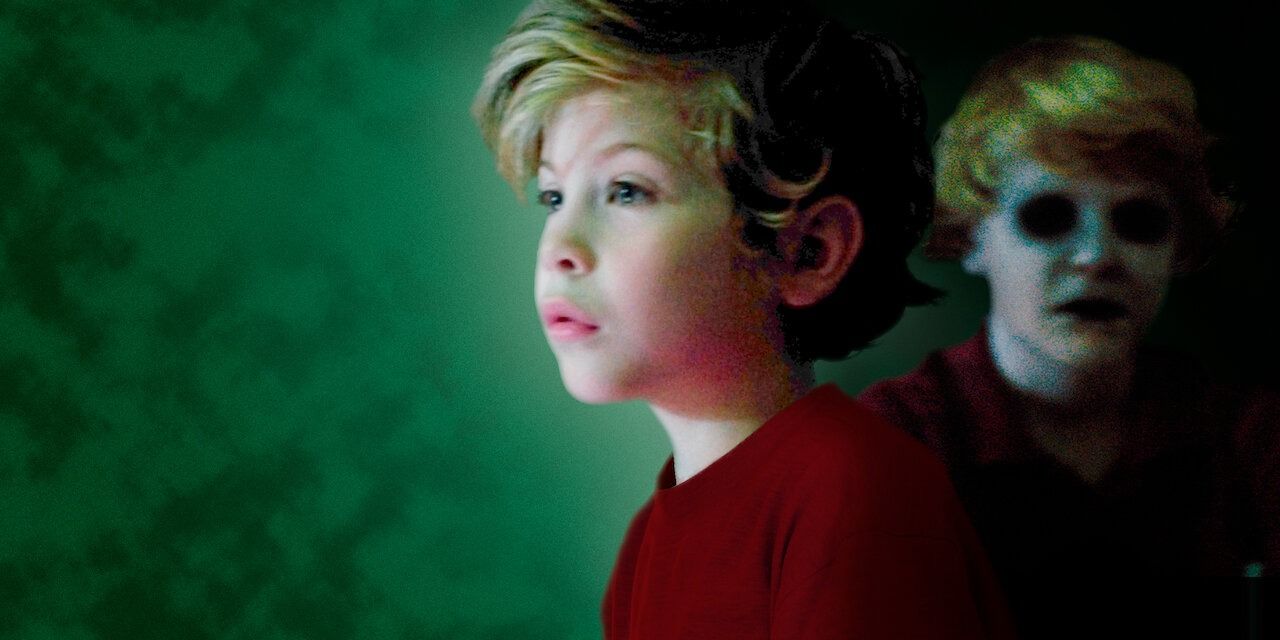Before I Wake - a demonic looking child stood behind an unknowing Cody