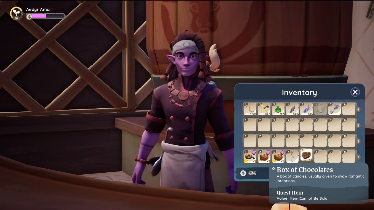 Player character speaking to Reth behind the counter in Kilima Inn with their inventory open and selecting a Box of Chocolates to gift him in Palia.