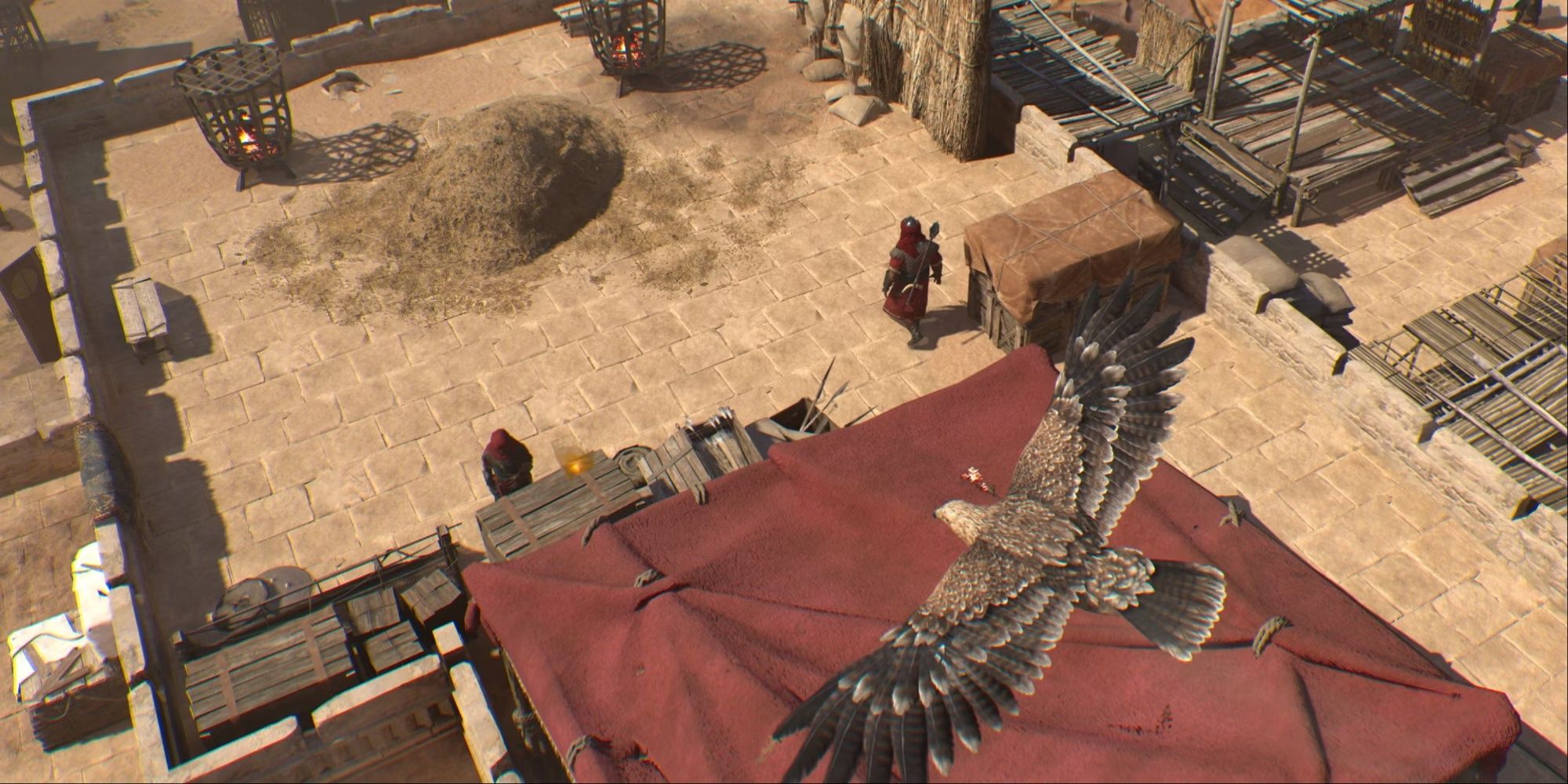 Your eagle Enkidu in AC mirage flying over a red tent where two guards are patrolling it.