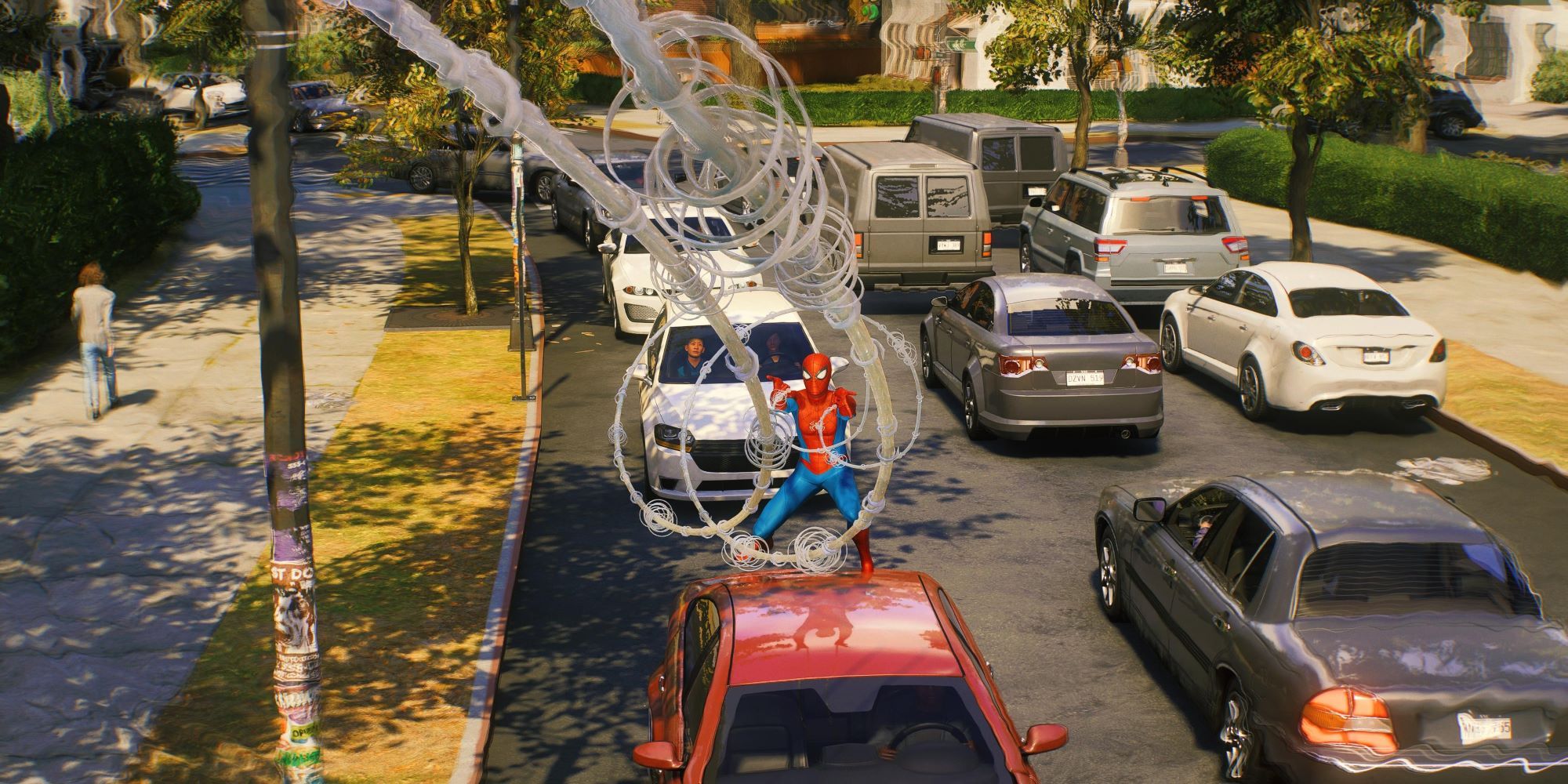 Marvel's Spider-Man 2 Peter standing on a car while firing webs