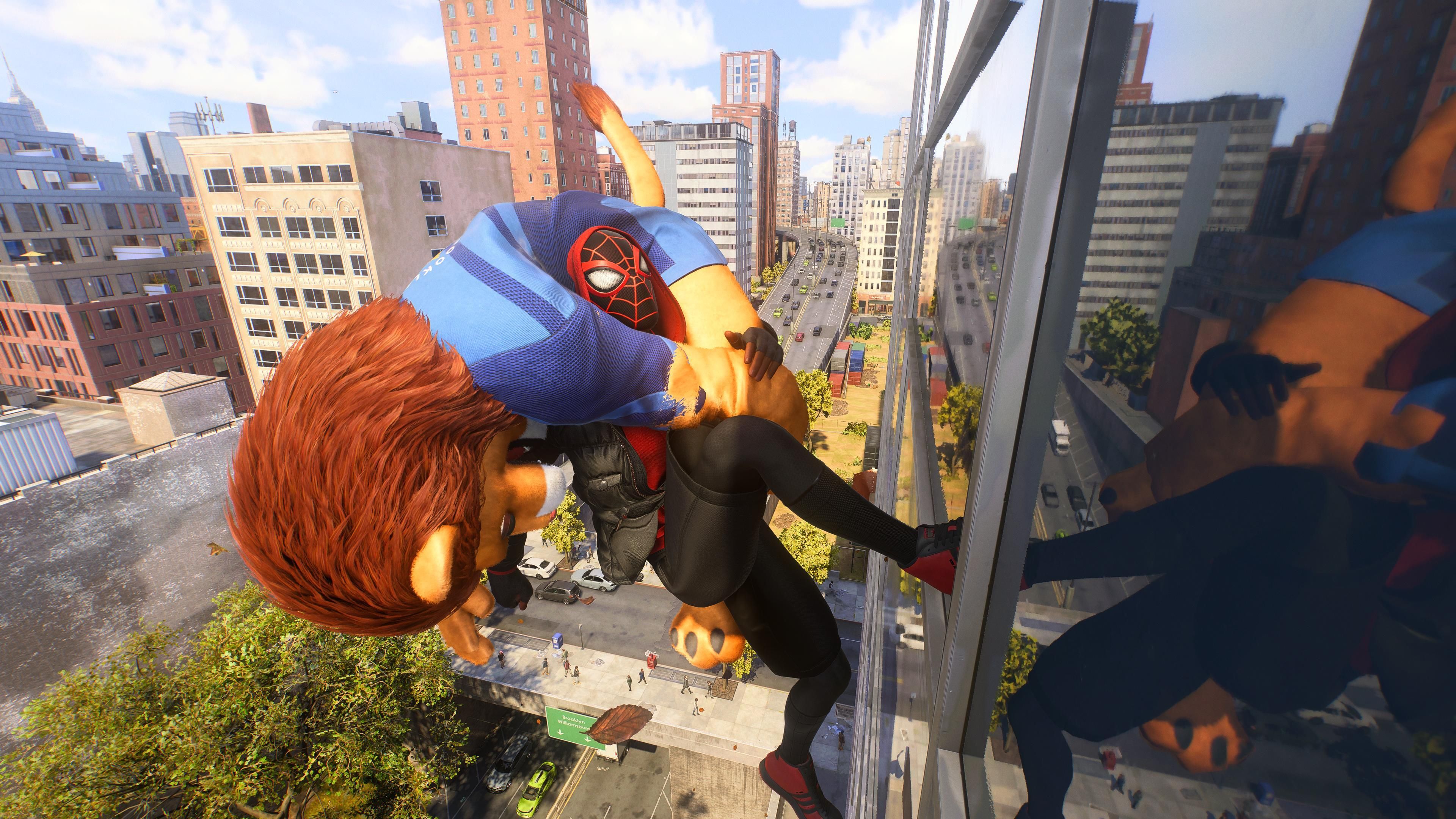 Spider-Man 2 screenshot of Miles Morales running up a skyscraper while carrying a man in a lion mascot costume