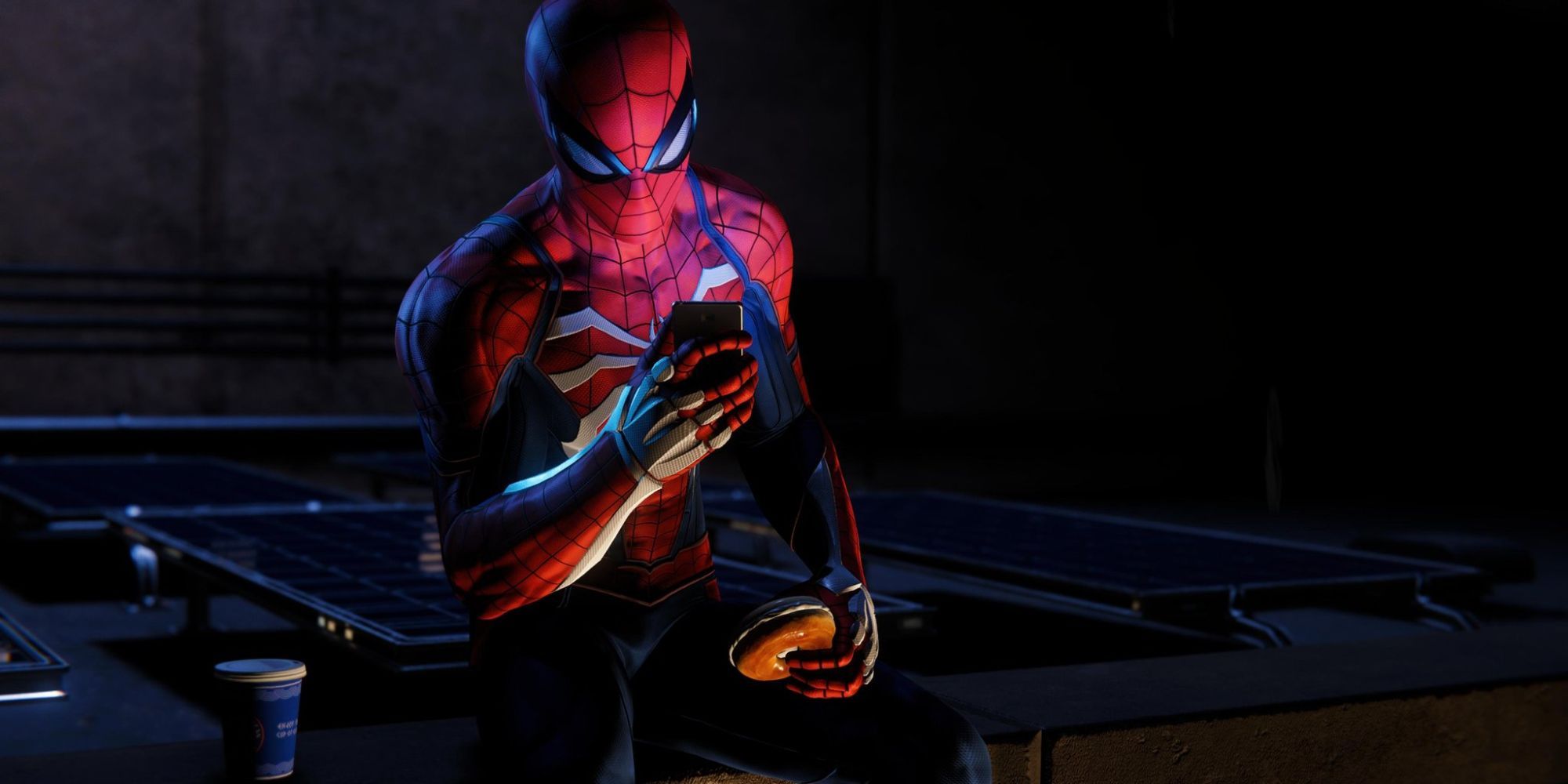 Spider-Man scrolls on his phone while a hamburger at night