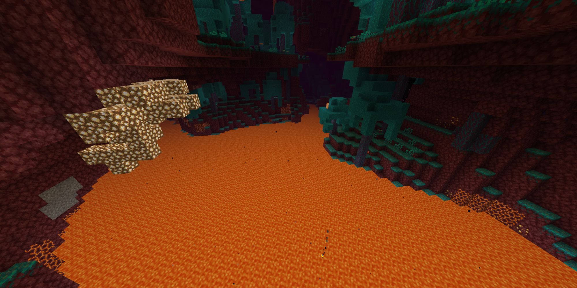 A large lake of reddish orange lava surrounded by yellow glowstone and red netherstone.