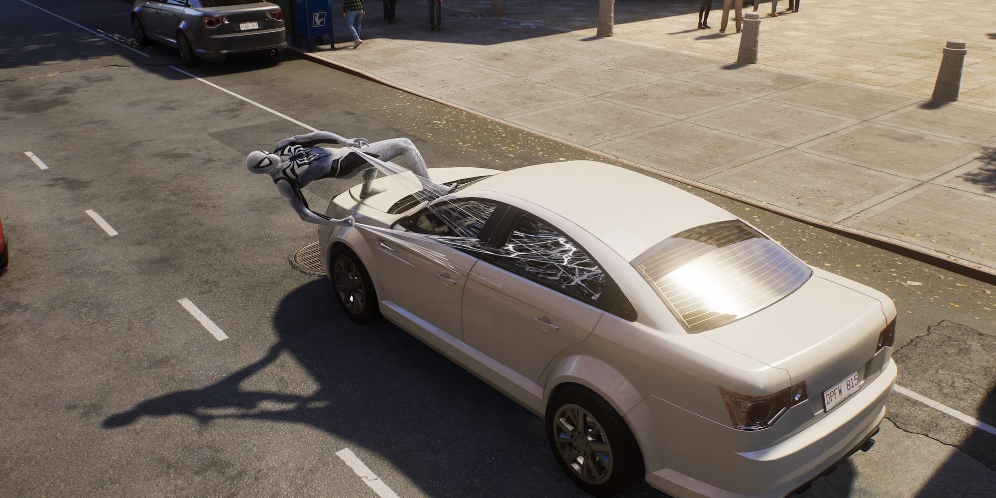 Spider-Man webs up the drivers of a stolen car in Spider-Man 2.