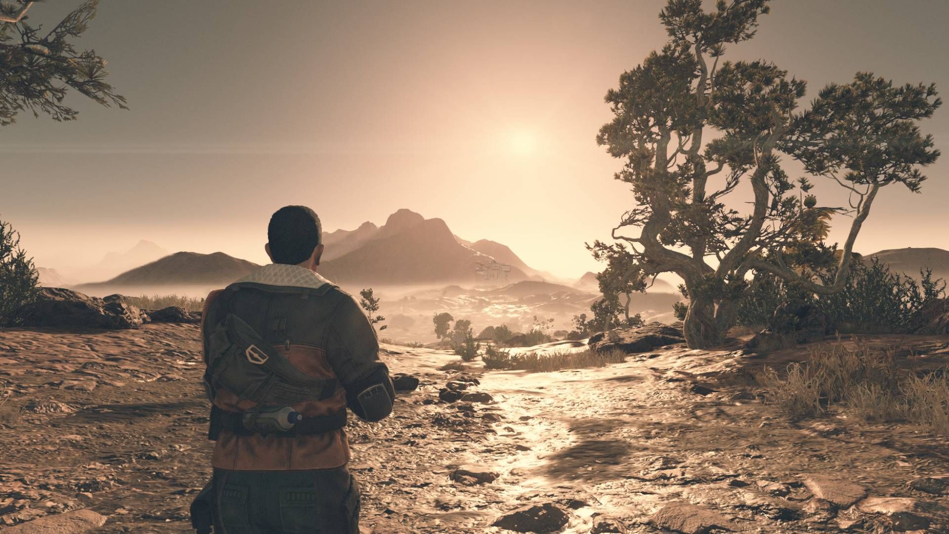 Davis Wilson walks outside Akila City during sunrise.