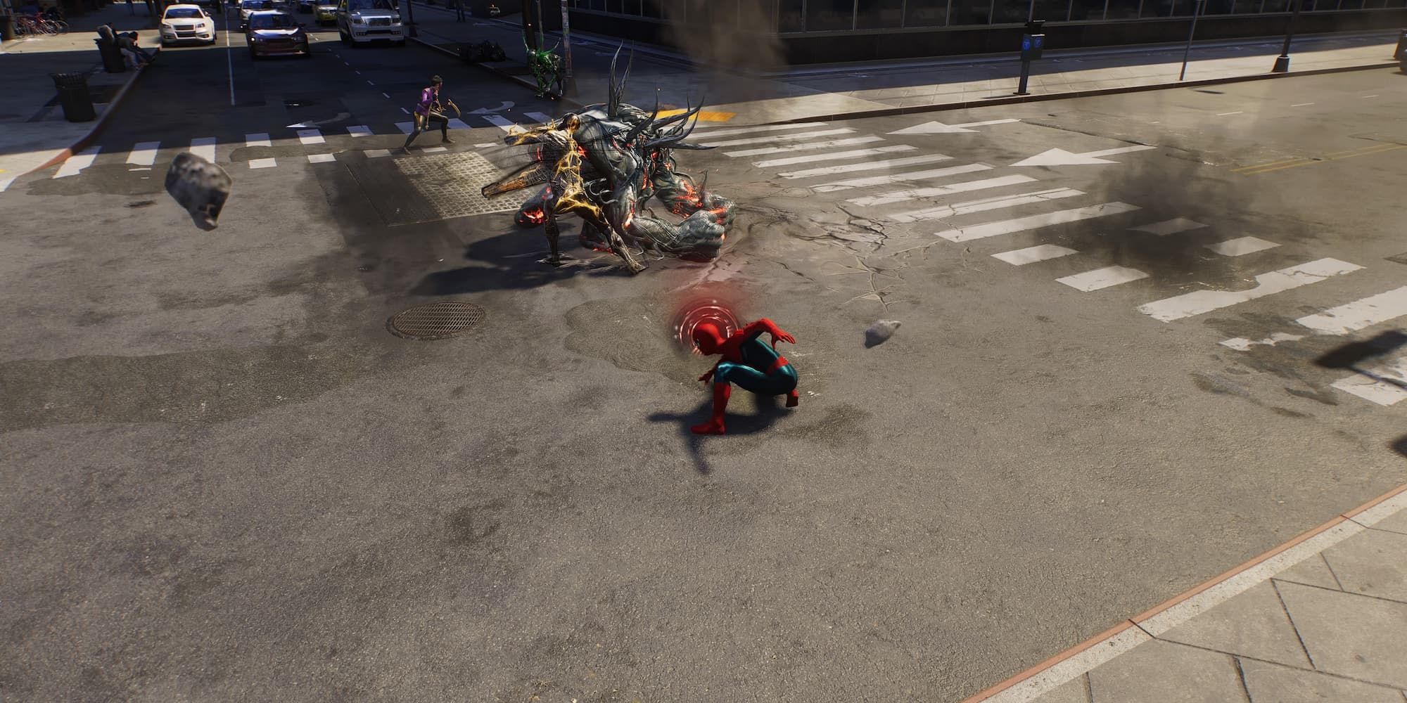 Spider-Man lands to fight a group of symbiotes in the street in Spider-Man 2.