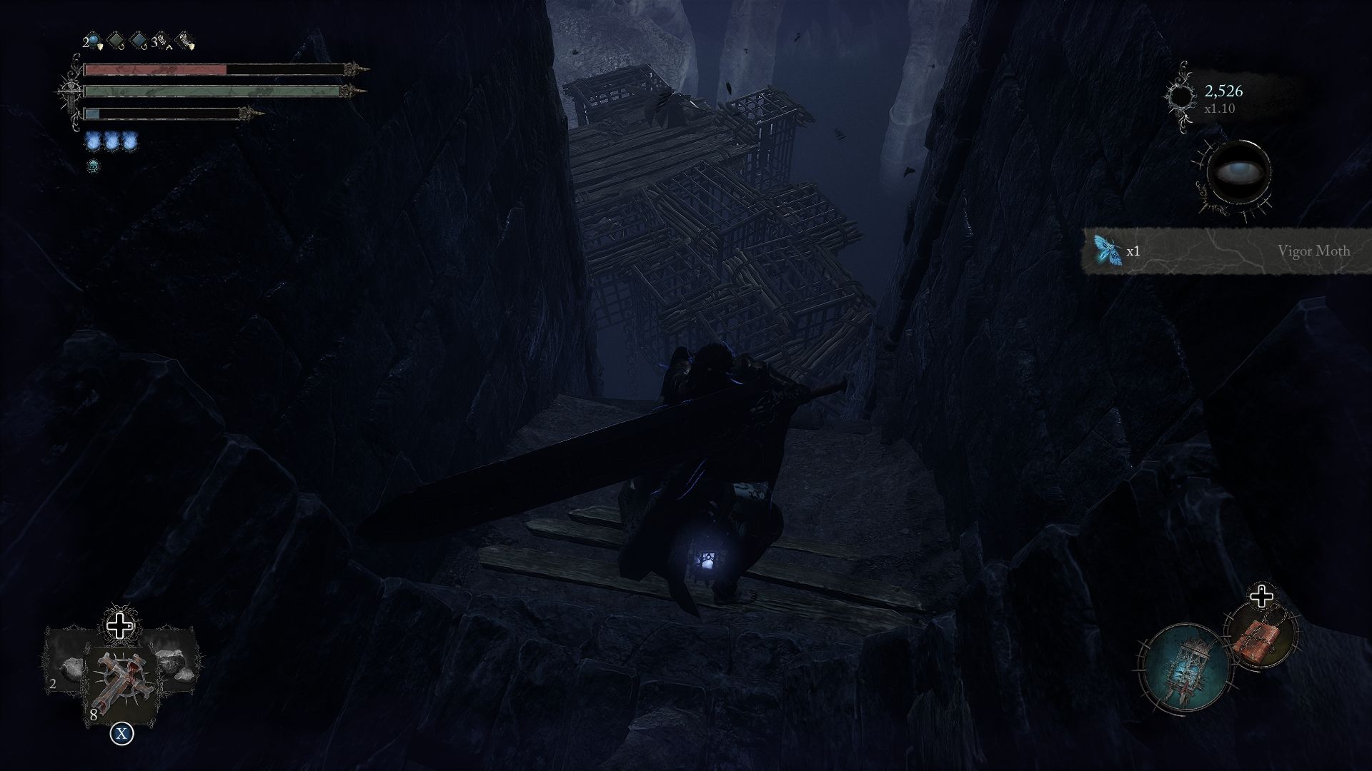 The player is looking down at a group of cages situated below him Lords of the Fallen