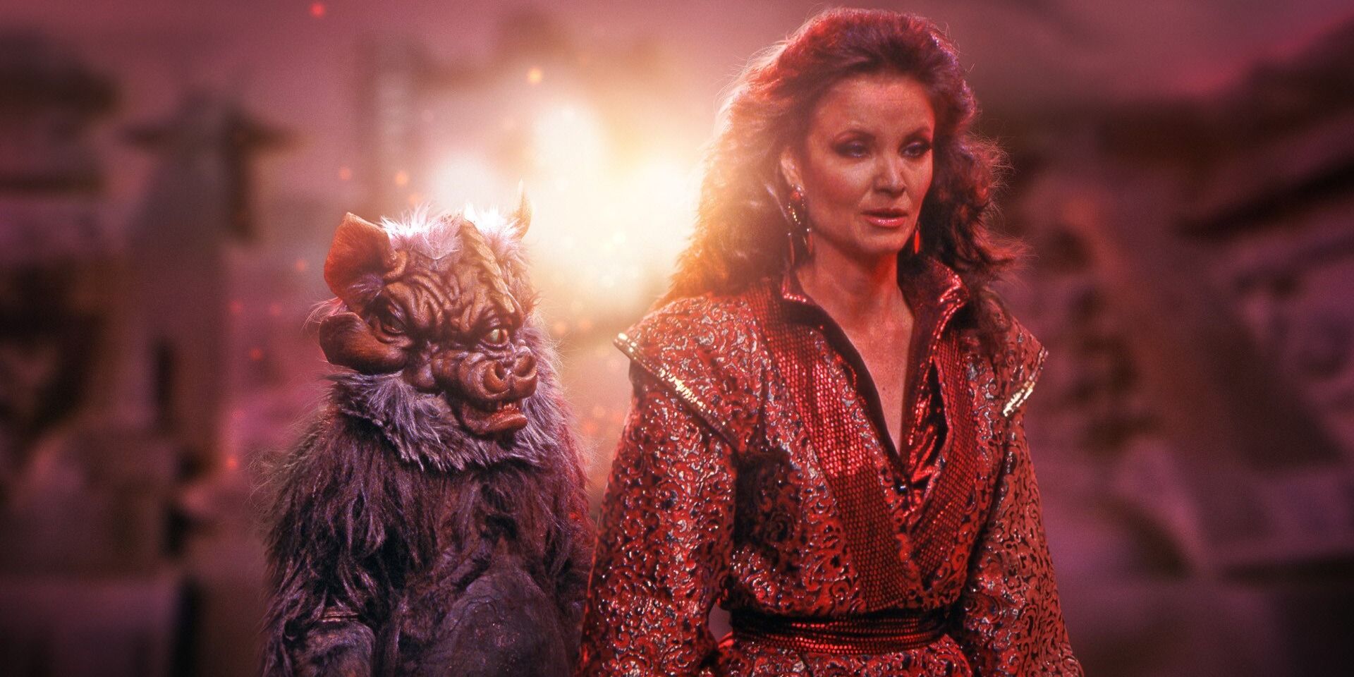 Doctor Who Villain The Rani standing in front of a small alien
