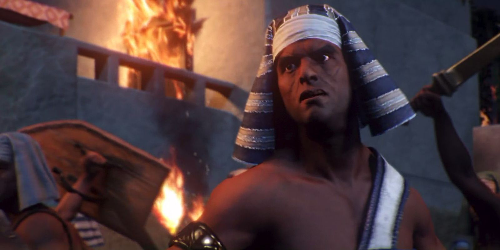 an egyptian soldier in a burning city during a cutscene in Total War: Pharaoh