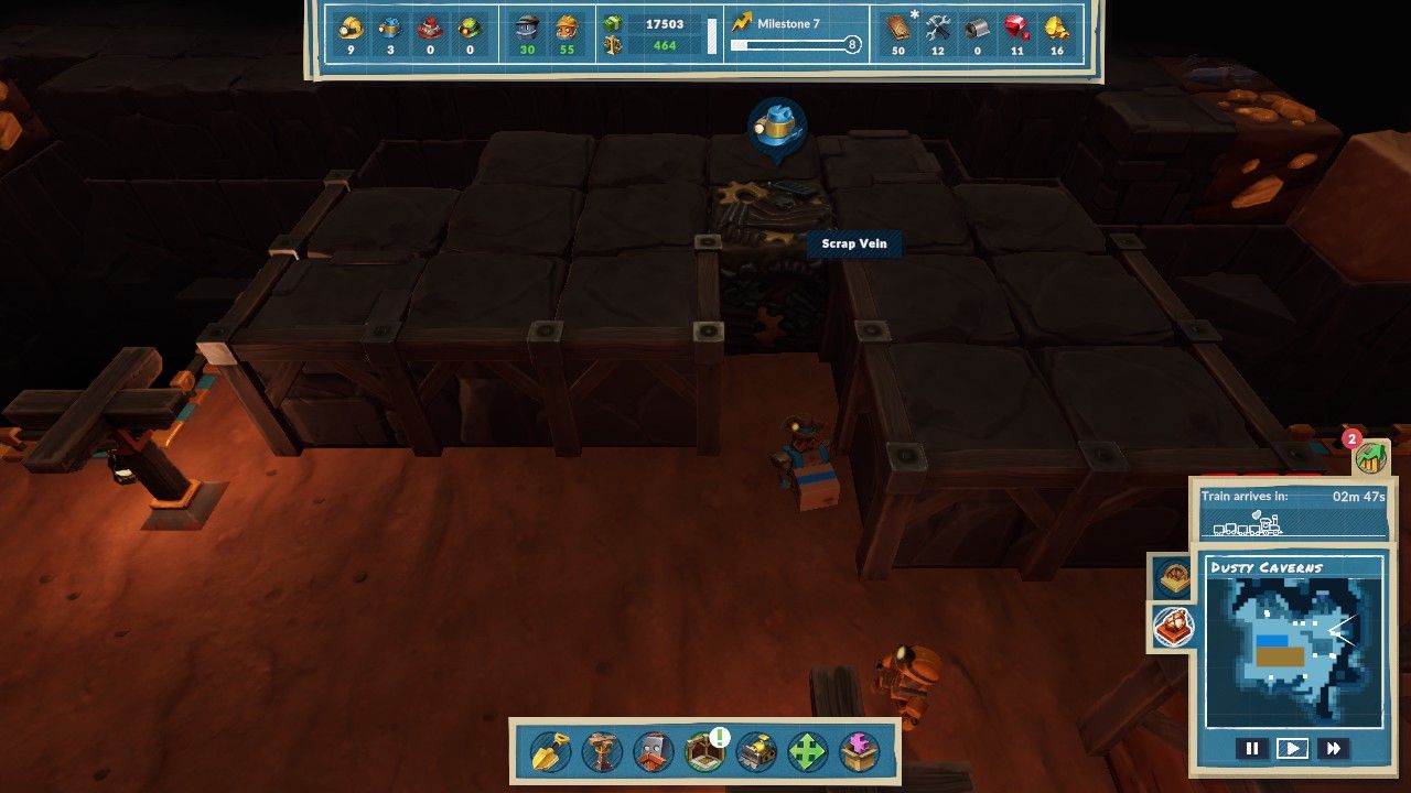 A Prospector Steambot transports away a box of Scrap away from a Scrap Vein embedded in a bedrock wall in Dusty Caverns in Steamworld Build.