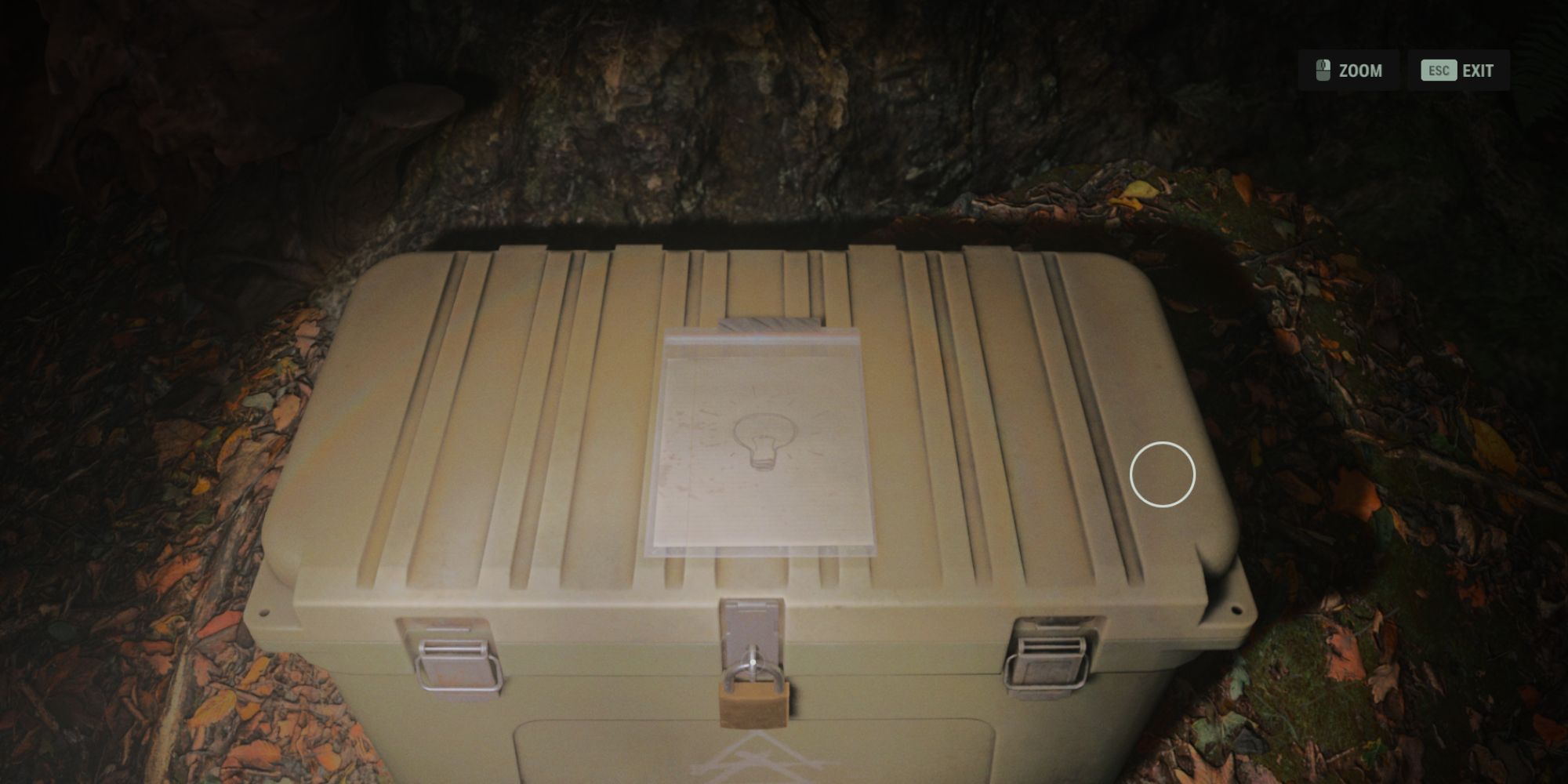 a cult stash in the woods near cauldron lake in alan wake 2, with a light bulb drawn on the lid